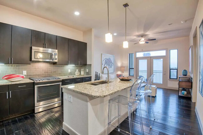 Building Photo - Making Midtown Buzz — Live in Style Today! Unit MTR1 Rental