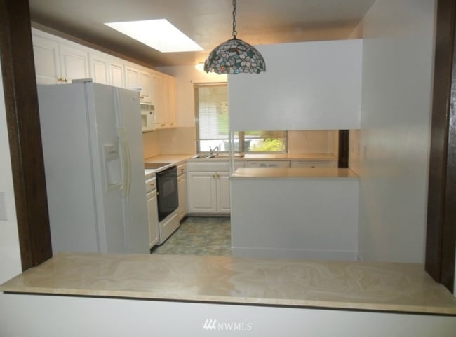 Photo - Spacious 4-Bed Tri-Level with 4-Car Garage — Walk to Elementary, Middle & High School