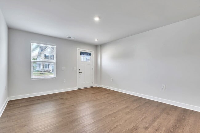 Photo - Modern Comfort: 3 Bed, 2.5 Bath Townhome + Primary on Main $2,050/mo rent