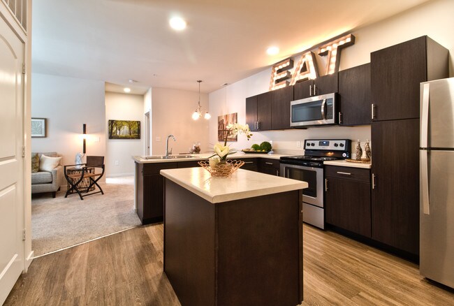 Spacious Kitchen with Island and Seperate Pantry - Aventura at Maryland Oaks Apartments