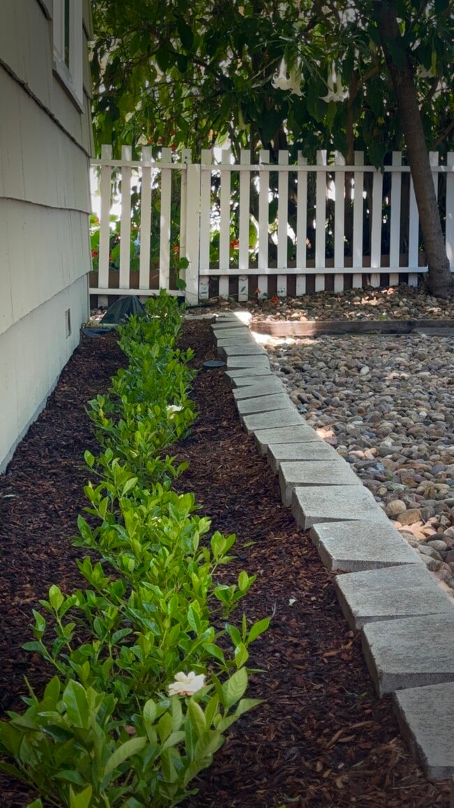 The property greets visitors with the scent of freshly planted gardenias. - 2403 Mira Vista Dr