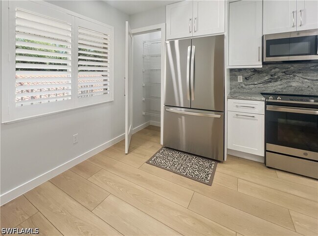 Building Photo - 5908 Cranbrook Way Unit I202