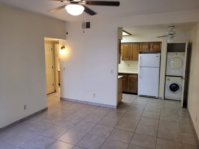 Ceiling fan in living room with open feel floor plan. - 5750 N Camino Esplendora Unit 120 Building A