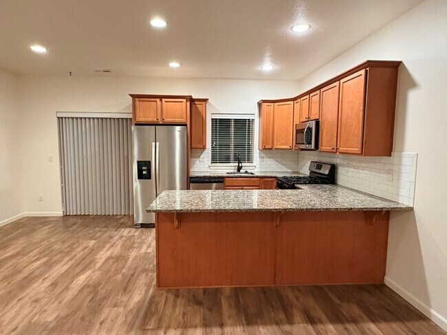 Beautiful Home w/Gas Fireplace, Plank Flooring, Fenced Yard, Garage, W/D & MORE!