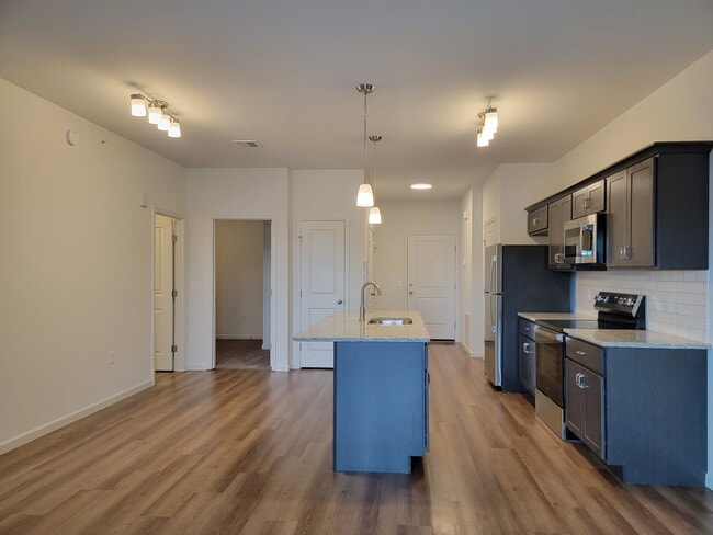 Madison Floor Plan - Kitchen & Dining Area (Wood Cabinets) - Red Mill Crossings