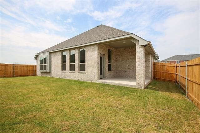 Covered patio has 2 patio chairs. Good backyard size. - 236 Painted Trail Unit House