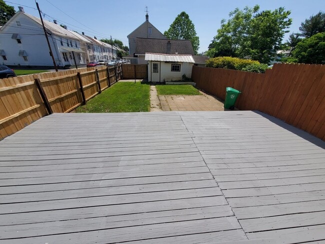 Photo - Pet friendly duplex w brand new kitchen & first floor LVP, basement, fenced yard, deck, near comm...