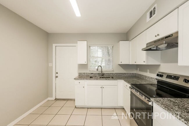 Photo - 3 BR/1BA | Newly Renovated Single Family Home | 1-Car Covered Parking | Gated backyard