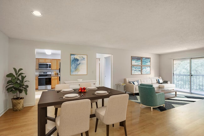 Upgraded Package I living and dining areas with hard surface flooring and balcony access