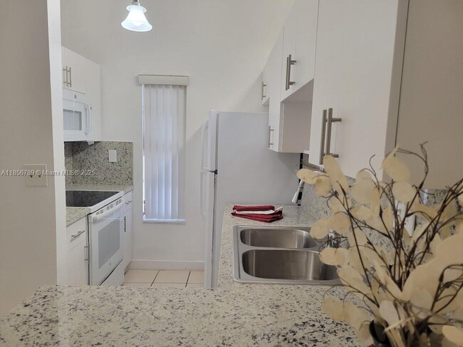 Building Photo - 7415 SW 153rd Ct Unit 203-7 Rental