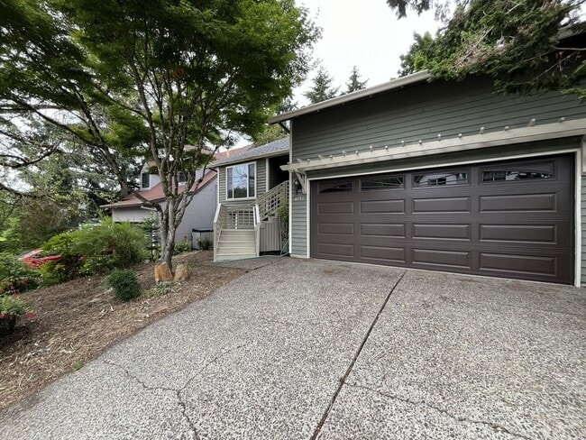 Photo - Spacious 3-Bedroom Home with Custom Stone Fireplace, Attached 2-Car Garage & Expansive Backyard i...