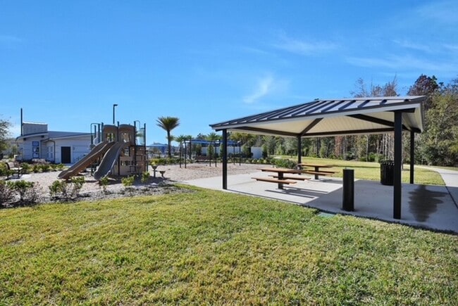 Photo - 2-Bed 2.5 Bath Townhome. Lawncare Included! Screened-in Lanai! Amenities: Dog Park, Playground, P...