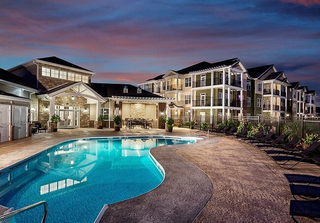 The outdoor fireplace, lounge, and grilling station opens up to Waterstone's pool and sundeck.
