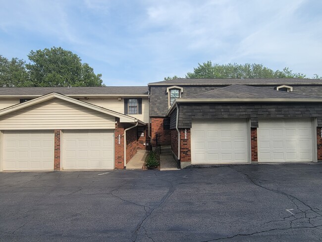Private 1 car garage and assigned parking lot space - 4534 Ohio St Unit Mississippi River View