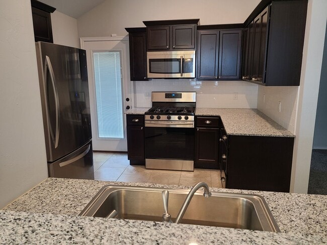 Photo - Open floor plan, Fridge included, fully fenced yard, neighborhood playground.