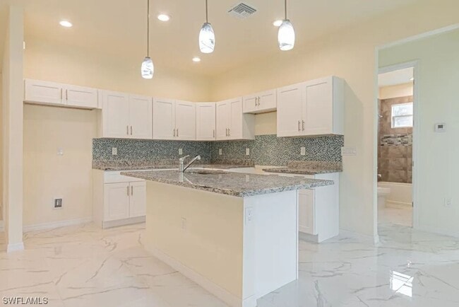 Photo - Stunning 3BR/2BA Home with 2-Car Garage & Screened Lanai in Lehigh Acres