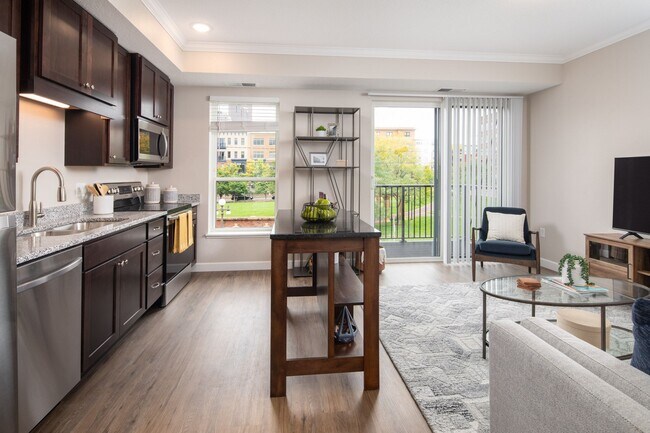View of kitchen and living room area looking onto the balcony at The Whitley.