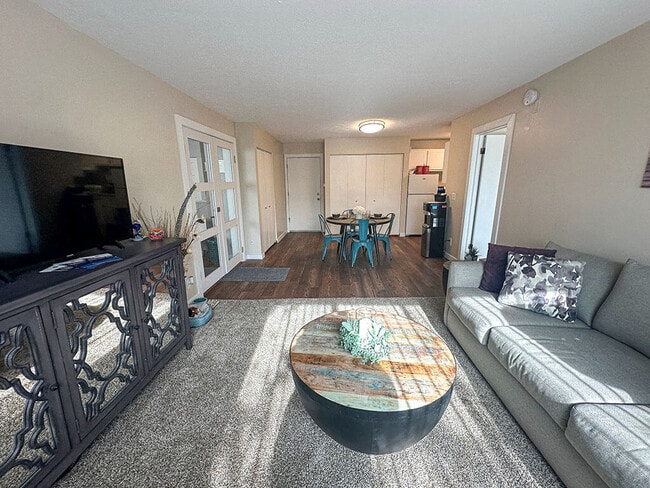 Carpeting Living Room with Natural Light - Shores of Roosevelt Park Rental