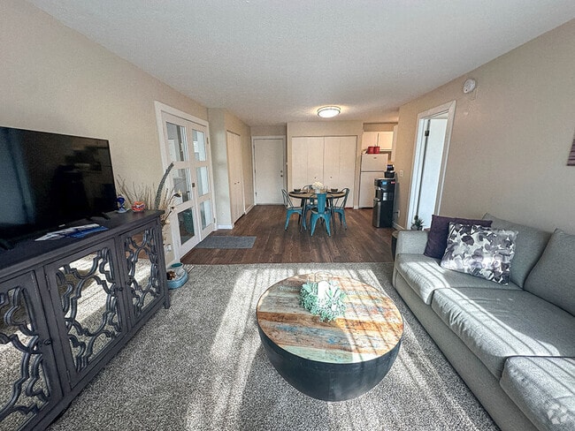 Carpeting Living Room with Natural Light - Shores of Roosevelt Park Rental