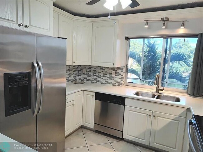 Photo - 9070 Lime Bay Blvd Condo Unit 208