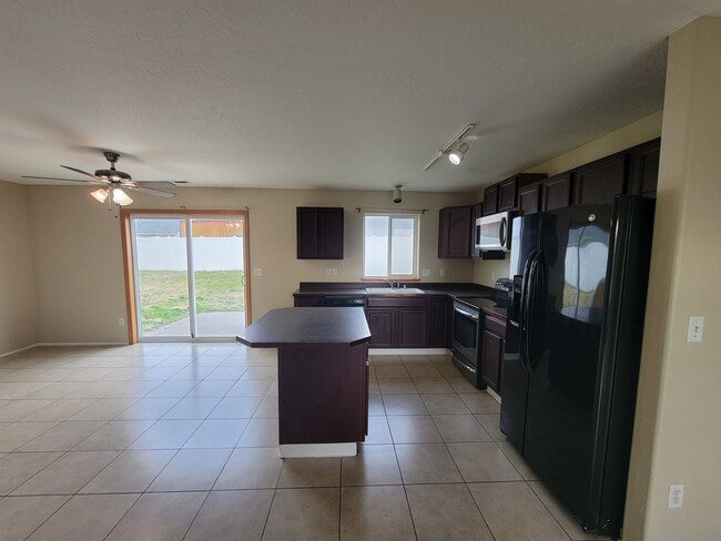 Photo - Comfortable 4-Bedroom Home with Fenced Bac...