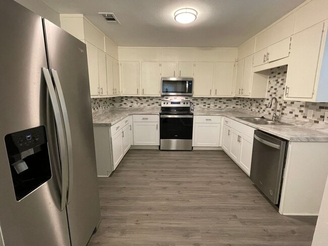 Photo - Available Now! Updated 4BR Home with Large Yard, Storage Shed & Modern Finishes