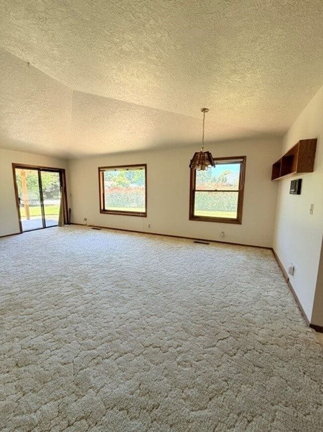 Photo - Charming 3-Bedroom Home with Garage & Lawn Care Included