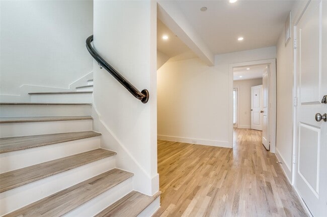 Photo - Beautiful townhome featuring granite countertops, hard wood floors, and a small private yard grea...