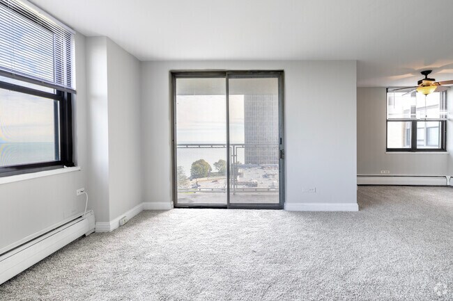 2BR2BA- Living room with Balcony - Oglesby Towers Apartments