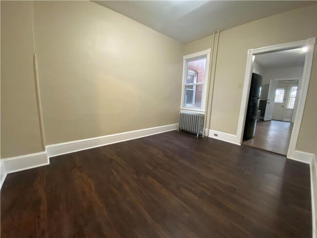Photo - Charming three-bedroom row house available...