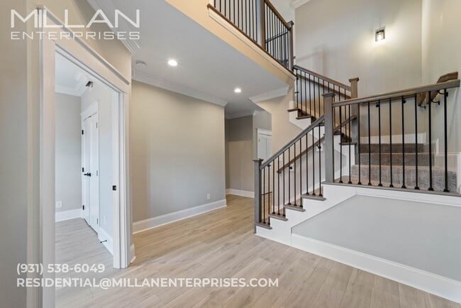 Photo - Luxury Living at Its Finest In Sango Featuring An Open Floor Plan, Fireplace and Resort Style Pri...