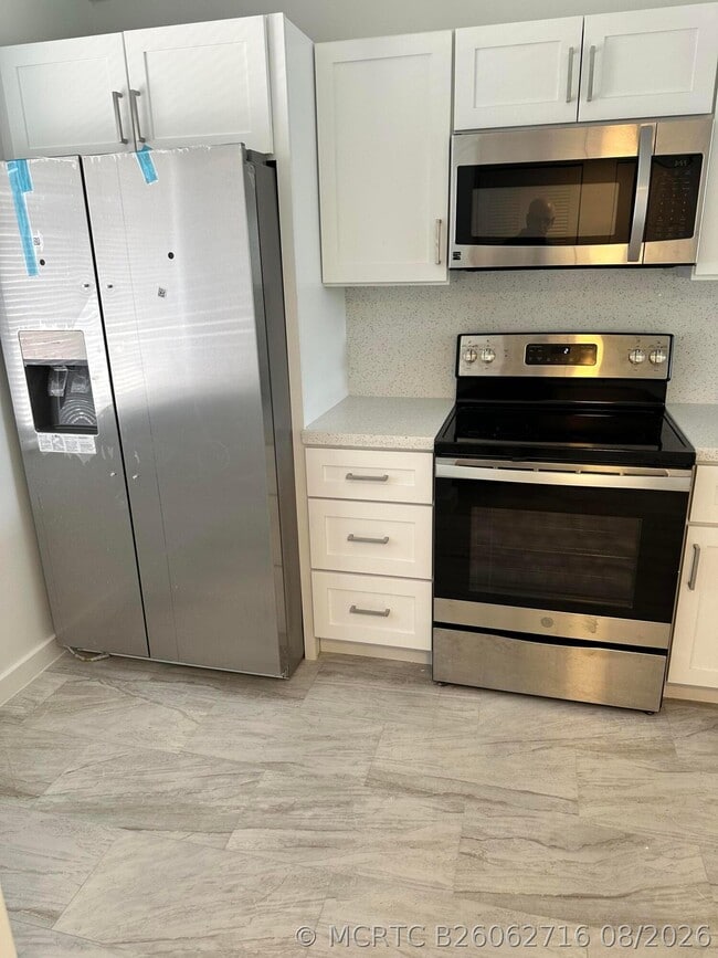 Building Photo - 7145 Huntington Ln Unit 408