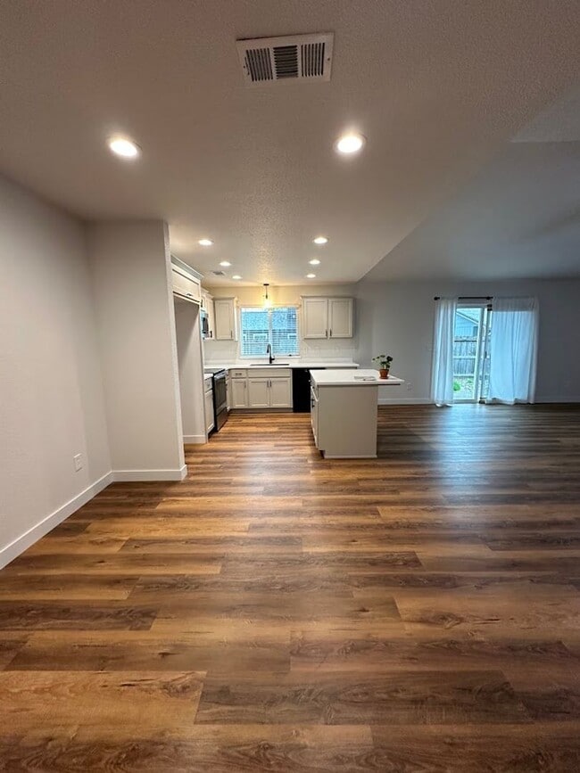 Photo - Updated Home with Island Kitchen, LVP Flooring, and Yard Care Included!
