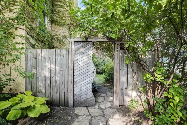 Curved gate leading to side yard. - 3032 grand ave