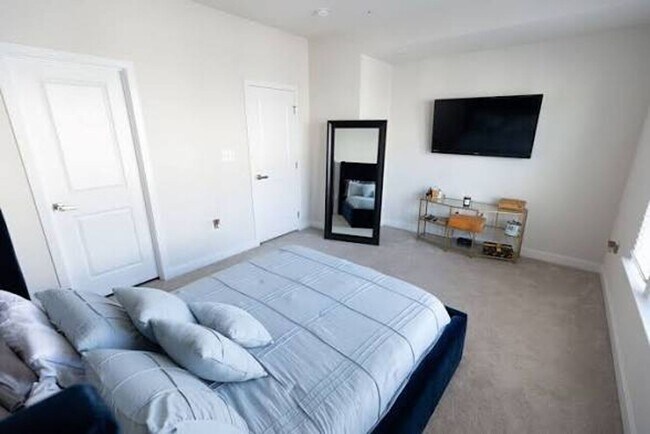 Photo - Available Now! Discover urban living at its finest in this 4-level gem!