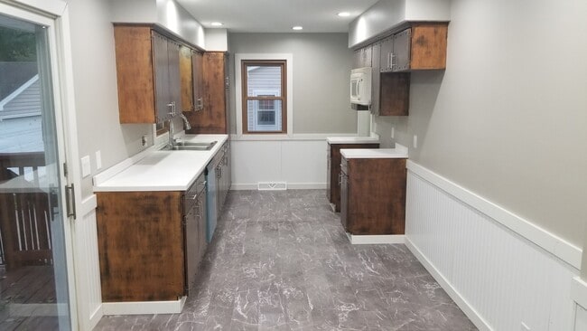 Stainless steel fridgerator, stove, and microwave included. - 719 34th St