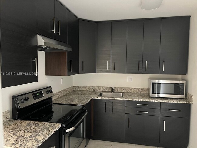 Building Photo - 7727 SW 86th St Unit A1-207