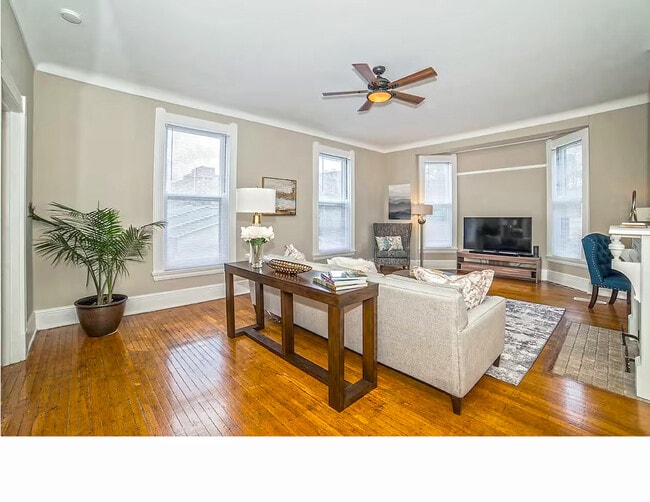 Beautiful hardwood flooring and large new windows - 1104 Cross Ln Unit 2