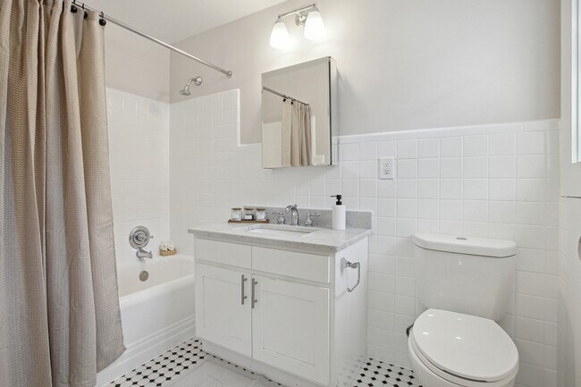 Bathroom with Ceramic Tile, Operable Window, and Deco Tub
