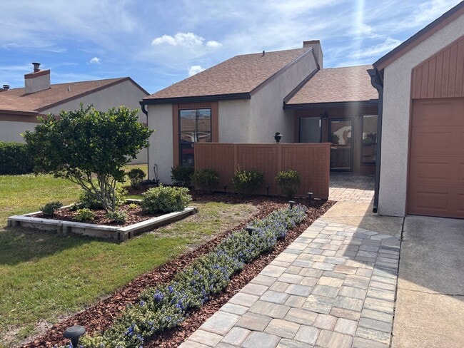 Photo - 2 Bed 2 Bath Luxury Waterfront Townhome with Screened Lanai & Garage!