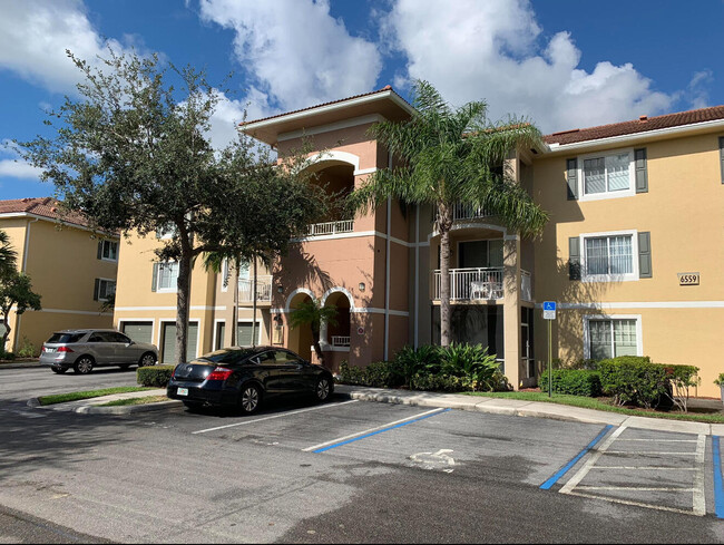 Building Photo - 6559 Emerald Dunes Dr Unit 201 Rental