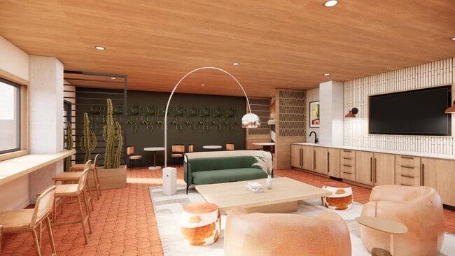 Lounge with gathering space, comfortable seating, and shuffleboard at Modera Rio Salado in Tempe, AZ. - Modera Rio Salado