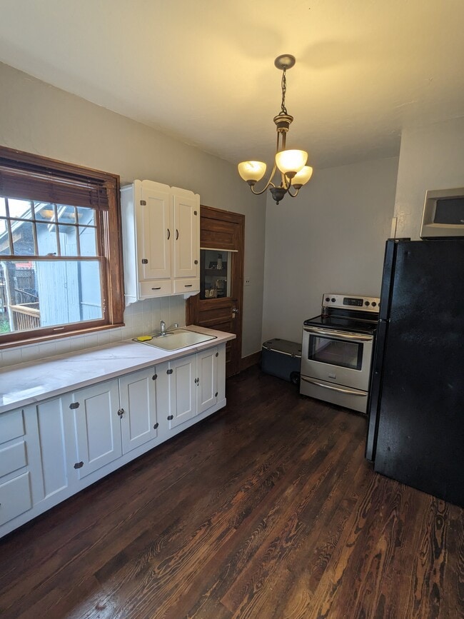 Kitchen Area - Stove & Fridge Included - 214 W 10th Ave Apartments Unit 1