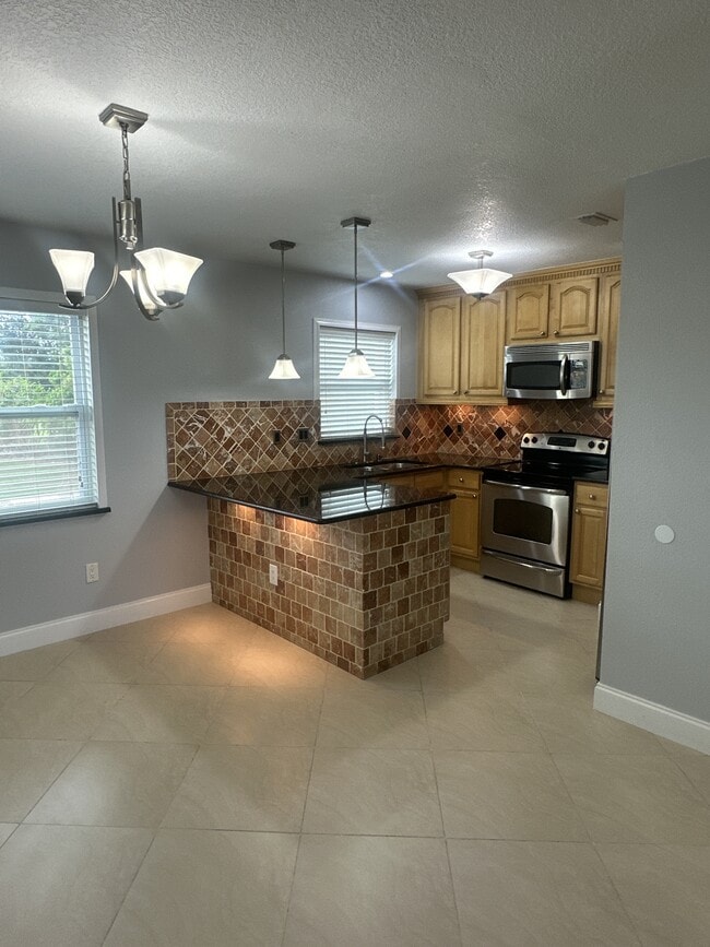 Building Photo - 7210 N Manhattan Ave Unit 1621 Rental