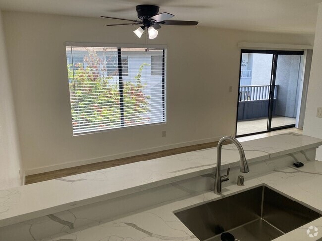 Building Photo - 2BR/2BA Upstairs Condo with Two-Car Garage Unit 702