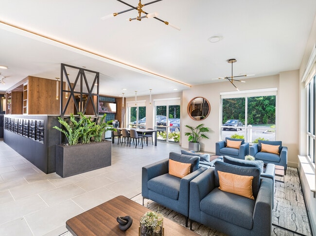 Indulge in community and caffeine at Modera Montville's expansive clubroom, your ultimate gathering space with a chic coffee bar.