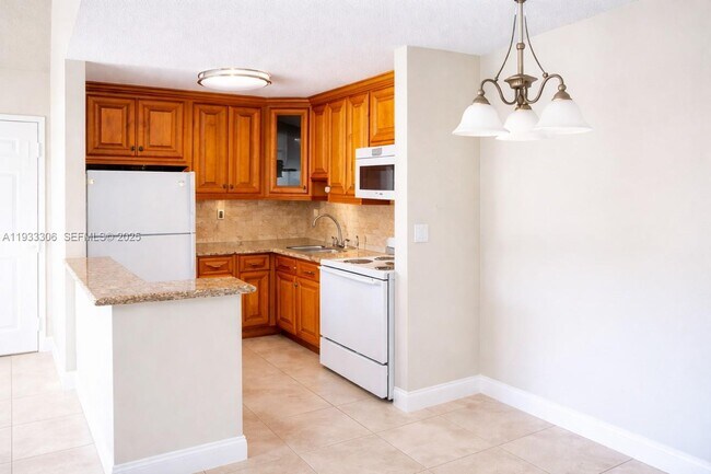 Building Photo - 15650 SW 80th St Unit F-301