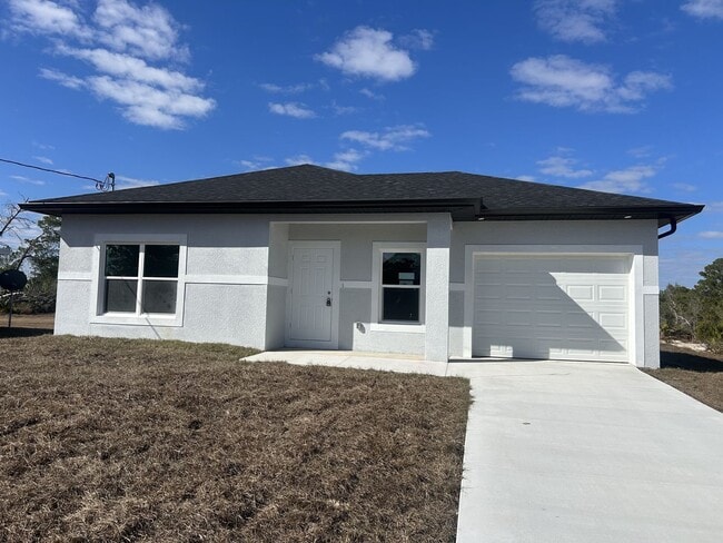 Building Photo - Brand-New Modern 2BR/2BA Home with Garage – Desirable Lake Placid Location