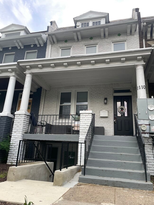 Enjoy a large front porch on this classic rowhouse street. - 1110 4th St NE