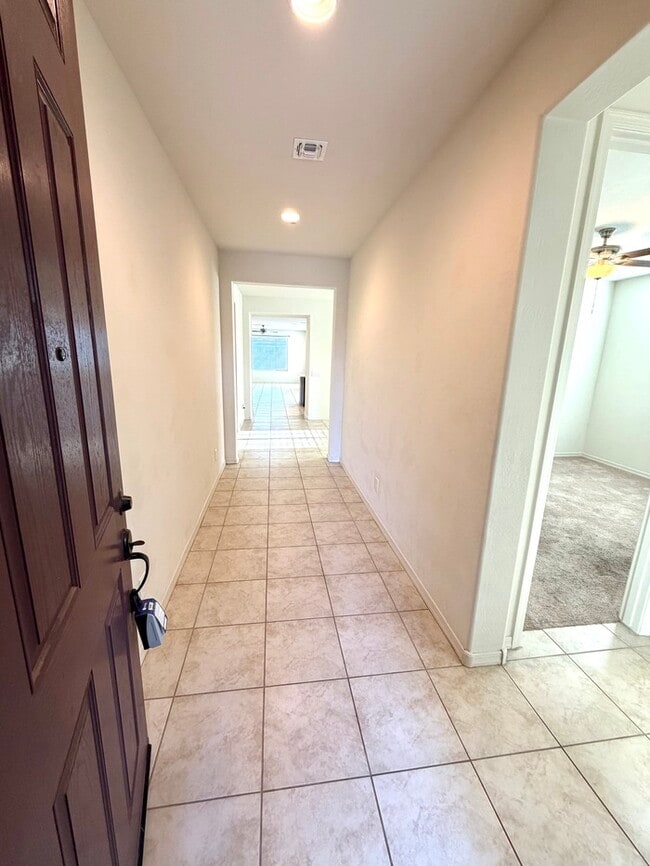 Beautiful 4BR/3BA single-story home in Harvest Queen Creek! Built in 2021 with 2,306 SF, den, che...